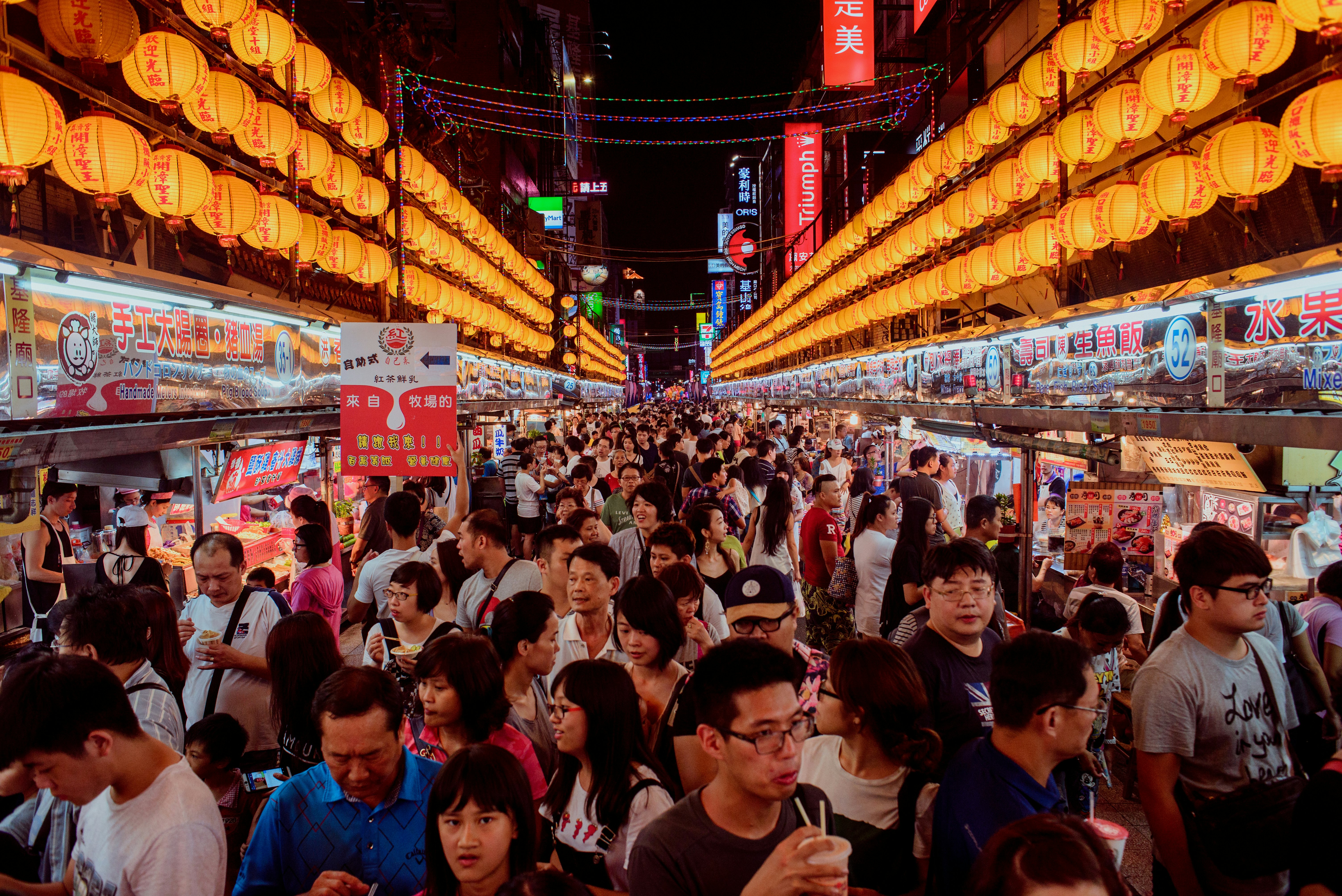 people in a market during night time